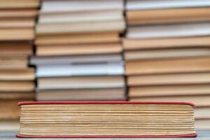 Old book in the red obnozhka. Symbol of knowledge and learning. photo