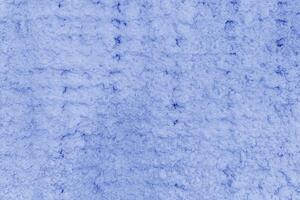 Texture of blue plaster. Rough wall of the building. photo