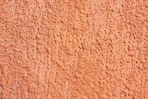 Texture of rough beige plaster. Architectural abstract background. photo