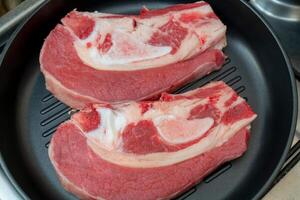 Breast of beef on the bone. Cooking in the kitchen. photo