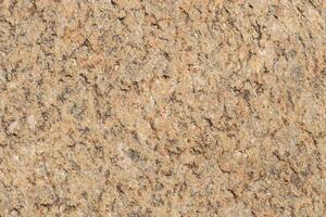 The texture of the stone with various impregnations. photo