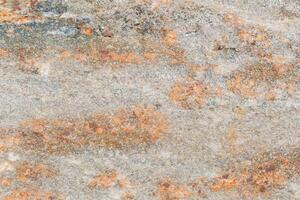 The texture of the stone with various impregnations. photo