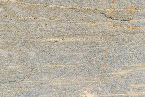 The texture of the stone with various impregnations. photo