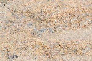 The texture of the stone with various impregnations. photo