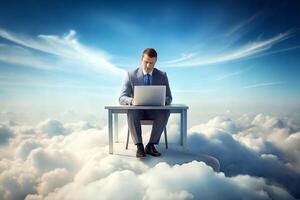 A man is sitting at a desk in the clouds. He is using a laptop. Concept of wonder and imagination, as it is not a realistic depiction of a man working in the clouds. photo