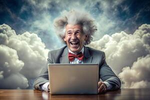 A gray-haired, broken elderly man in a red bow tie sits at a table with a laptop. He smiles and he is happy. photo