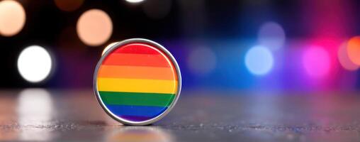 An lgbt flag pin on a background of bokeh lights photo