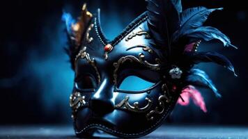 Black venetian mask with feathers on a dark background photo
