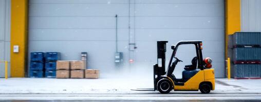 A forklift is parked in front of an open warehouse photo