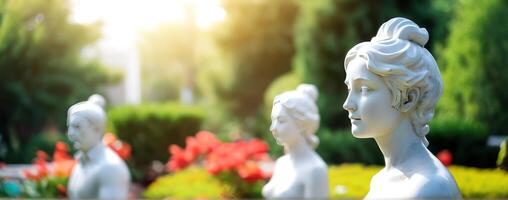 Statues of women in a garden photo