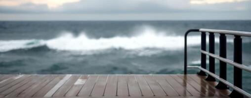 A view of the ocean with waves crashing over the railing photo