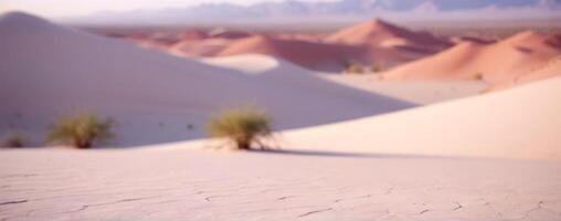 A blurry image of sand dunes in the desert photo