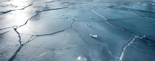 An image of a frozen surface with cracks in it photo