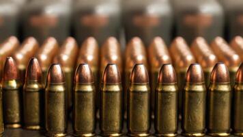 Bullets are lined up on a table photo