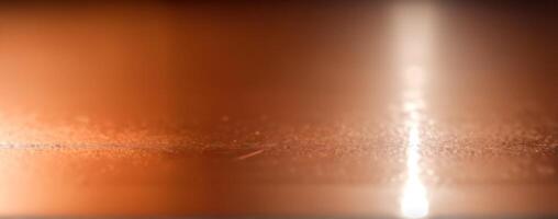 A blurry image of an orange metal surface photo