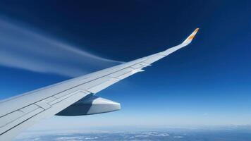 The wing of an airplane in the sky photo
