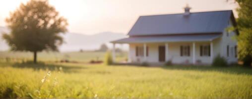 A blurry image of an old house in the countryside photo