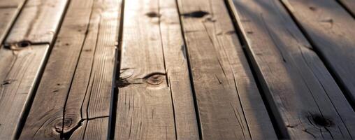 An image of a wooden deck with sunlight shining on it photo
