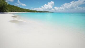 A beach with white sand and blue water photo