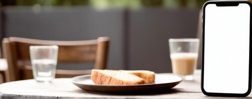 An iphone xr on a wooden table with bread on it photo