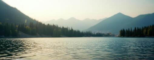 A lake with trees and mountains in the background photo