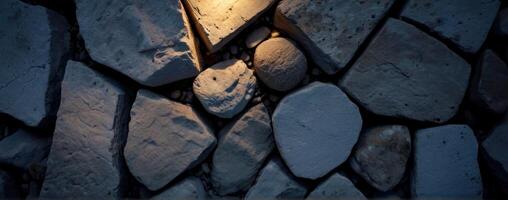 A stone wall with light shining through it photo