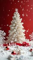 Beautifully decorated artificial Christmas tree in a festive red and white setting with snowflakes photo