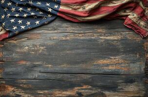 Worn American flag draped over rustic wooden surface, reflecting history and patriotism photo