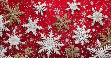 Festive decorations featuring golden and white snowflakes on a vibrant red background photo