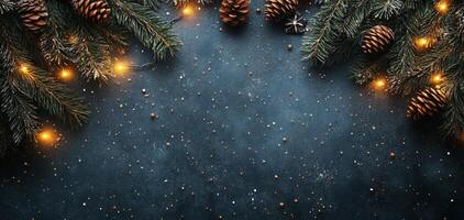 Festive pine branches with glowing lights and pine cones on a dark background in winter photo