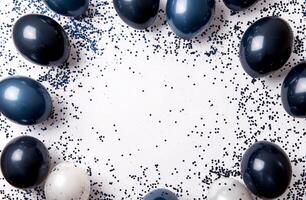 Colorful balloons with confetti arranged in a festive circle for a celebration photo