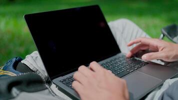 Close-up of hands typing on laptop keyboard. Programmer is developing new software. Writing program code on laptop. Work stress. Anxiety. Work mindset. Work outdoor. video