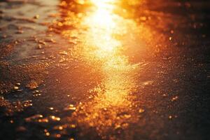 Sunset glow reflecting on wet sandy surface near the shoreline during a calm evening photo