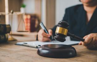 Law theme, mallet of the judge, law enforcement officers, evidence-based cases and documents taken into account. photo