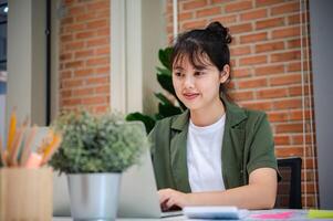 Freelance worker working on documents with graphs. and information about finances on laptops in cafes photo