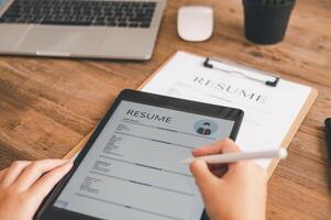 Individuals or recent grads looking for work and filling out a job application should first evaluate the application before applying for a position. photo