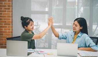 Business colleagues making a fist bumpp are happy to work together successfully , Working in a reliable team photo