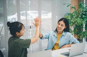 Business colleagues making a fist bumpp are happy to work together successfully , Working in a reliable team photo