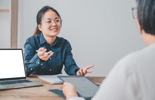HR managers are interviewing job applicants who fill out their resume on the job application form in order to consider accepting a job as a company photo