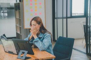 Female programmers are sleepy and exhausted after working and planning to work on programming, software coding and web design. Concept technology development. photo