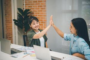 Business colleagues making a fist bumpp are happy to work together successfully , Working in a reliable team photo