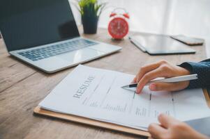 Individuals or recent grads looking for work and filling out a job application should first evaluate the application before applying for a position. photo