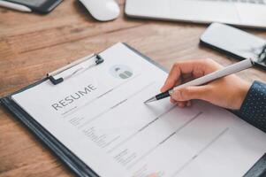 Individuals or recent grads looking for work and filling out a job application should first evaluate the application before applying for a position. photo