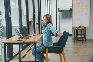 Female programmers are stretching oneself and relaxing after working and planning to work on programming, software coding and web design. Concept technology development. photo