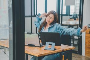 Female programmers are stretching oneself and relaxing after working and planning to work on programming, software coding and web design. Concept technology development. photo