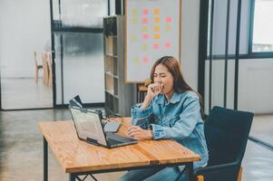 Female programmers are sleepy and exhausted after working and planning to work on programming, software coding and web design. Concept technology development. photo