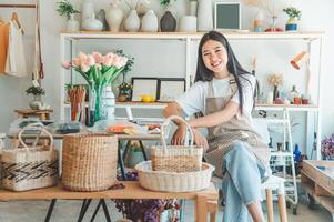 Small business owners pose smiling in their small shop to welcome customers and get customers online. And check the orders that customers have ordered of online retailers - online shopping. photo