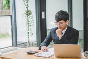 Businessman working online via call in team meeting with the charging of graphs for analysis, conceptual analysis and business planning photo