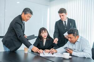 Business people team work while working in board room, design project, discussing ideas,discuss financial statistics together teamwork concept photo