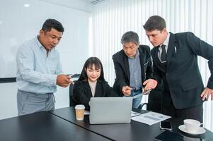 Business people team work while working in board room, design project, discussing ideas,discuss financial statistics together teamwork concept photo